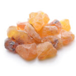 Amber-coloured frankincense olibanum resin on a white background