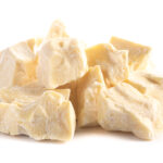 Chunks of Raw Organic Cocoa Butter Isolated on a white background