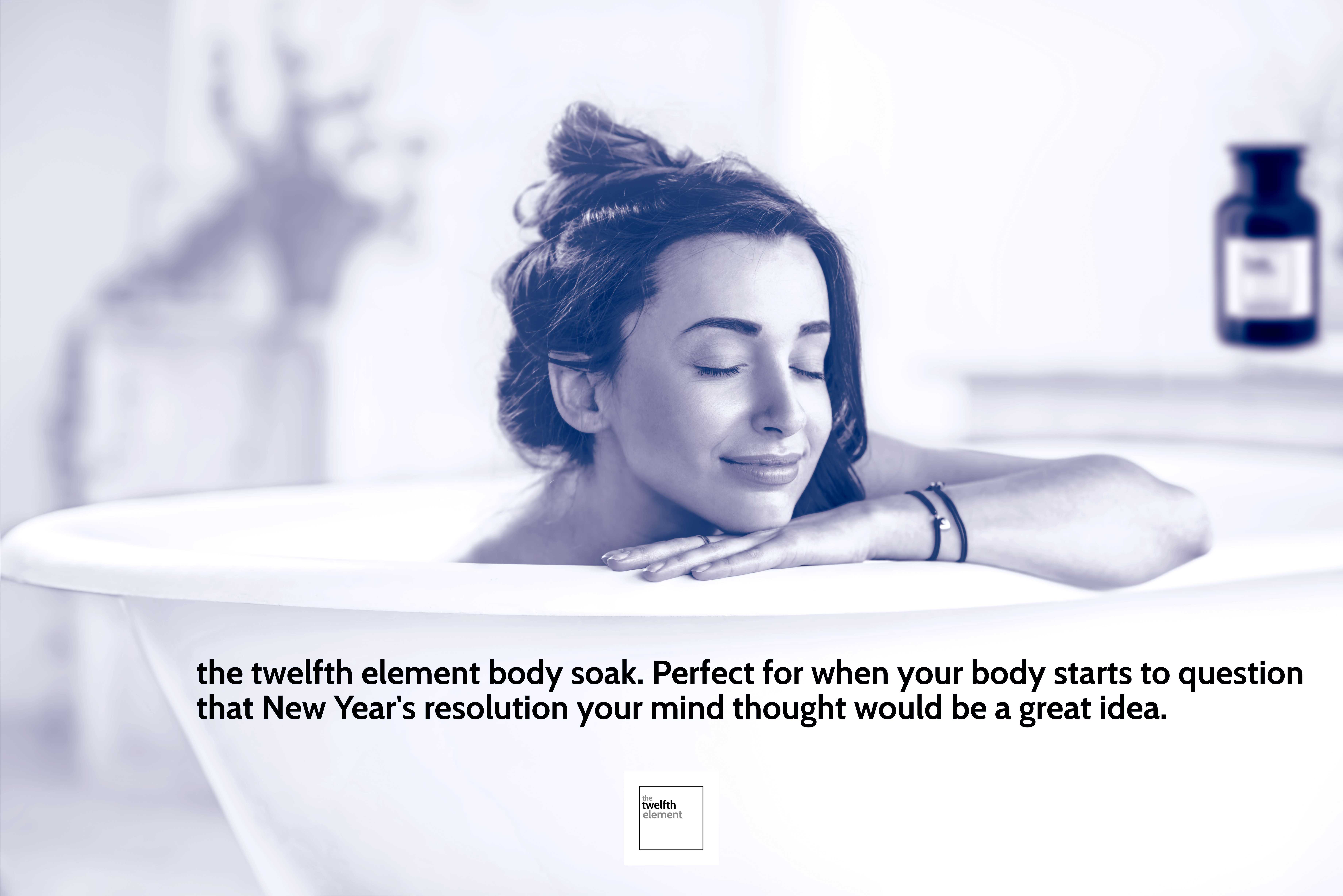 Woman relaxing in a bath tub filled with the twelfth element body soak, after a New Year's resolution exercise